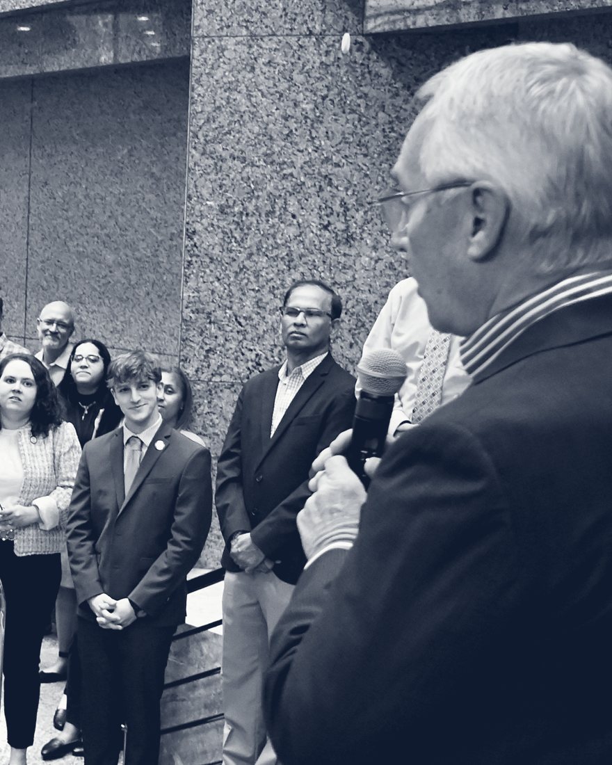 Lieutenant Governor Jim Tressel speaking to OFCC staff, with Anthony Schilt in the crowd